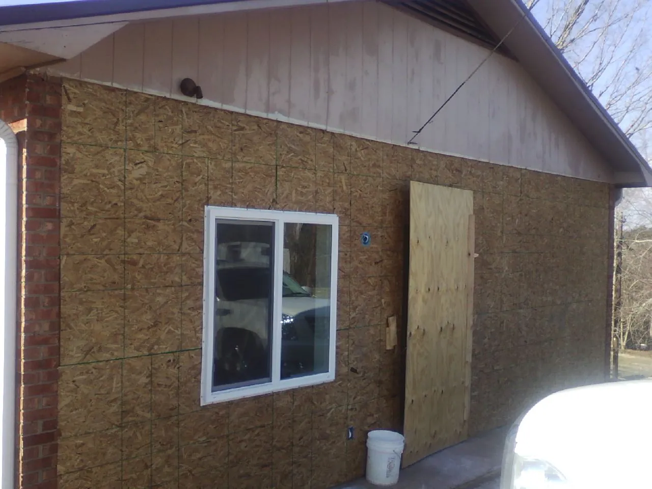 OSB sheathing on a garage addition wall before siding in Culver City
